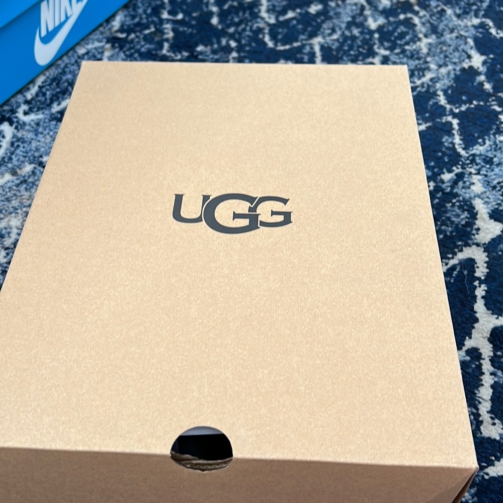 Pink and black UGG slippers